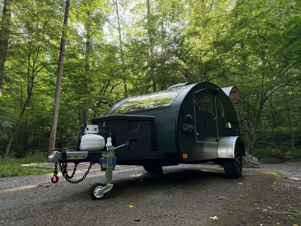 A teardrop camper at a creekside campsite in the Great Smoky Mountains